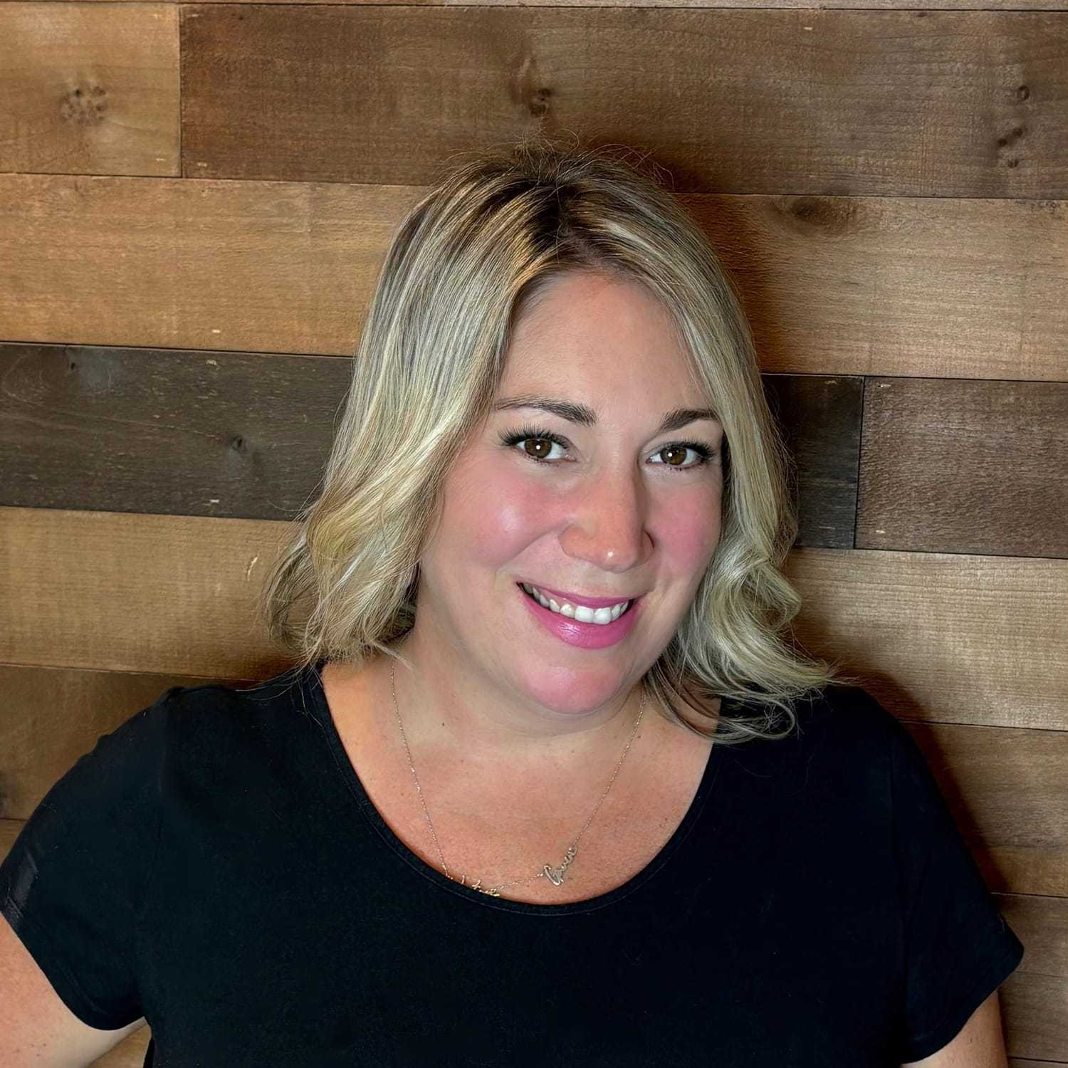 Portrait of Meaghan, a professional stylist at Laschi Hairstylists & Day Spa, showcasing their expertise and style.