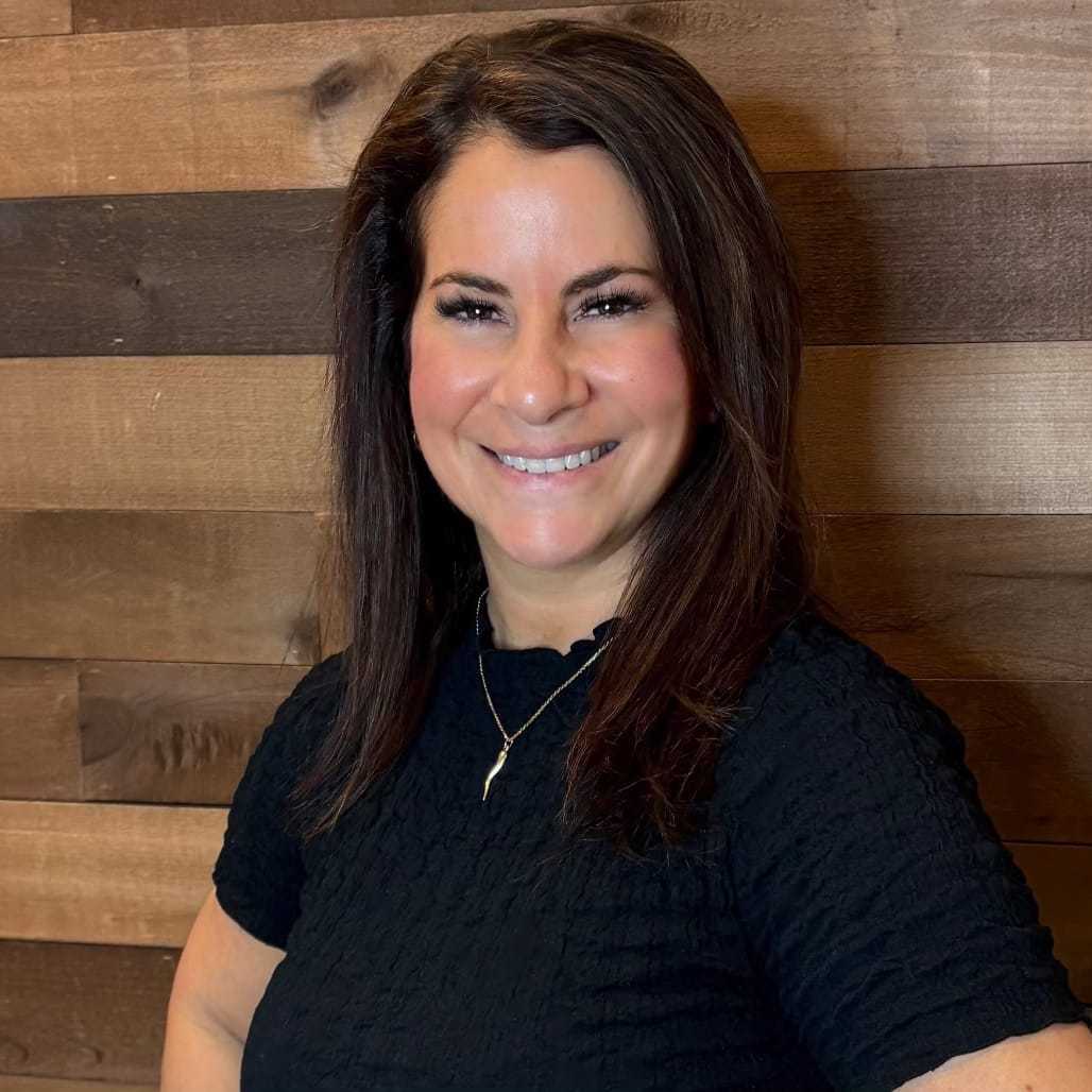 Portrait of Amy, a professional stylist at Laschi Hairstylists & Day Spa, showcasing their expertise and style.