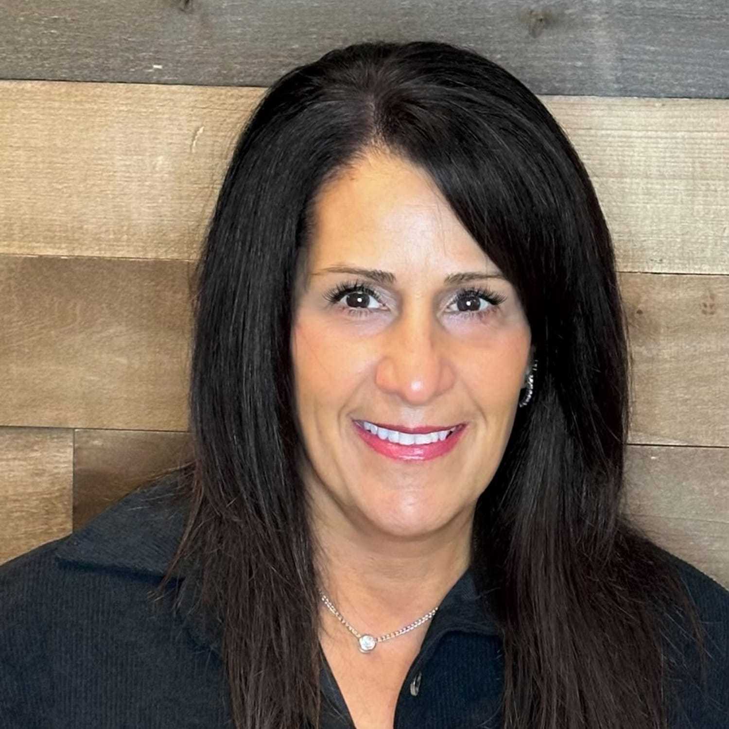 Portrait of Diana, a professional stylist at Laschi Hairstylists & Day Spa, showcasing their expertise and style.