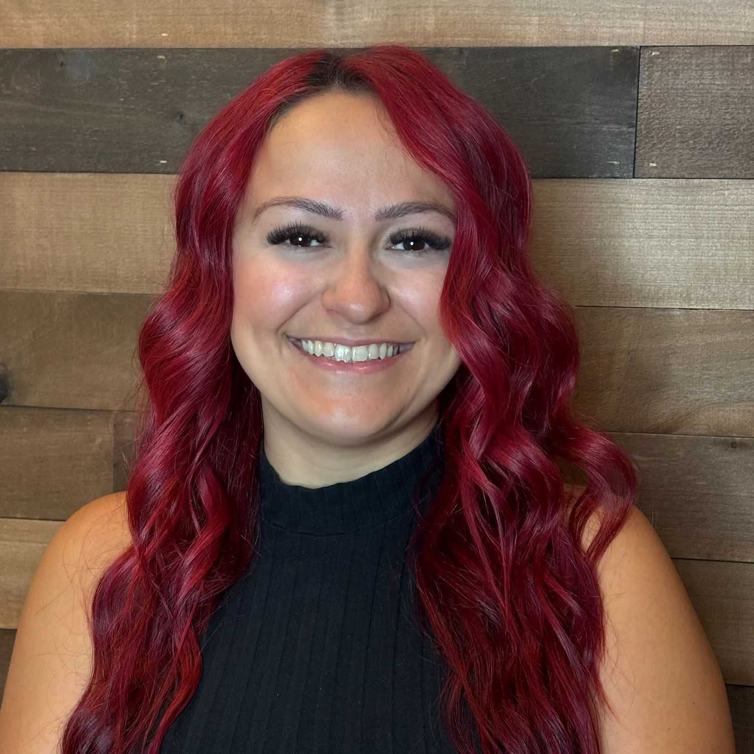 Portrait of Tasha, a professional stylist at Laschi Hairstylists & Day Spa, showcasing their expertise and style.