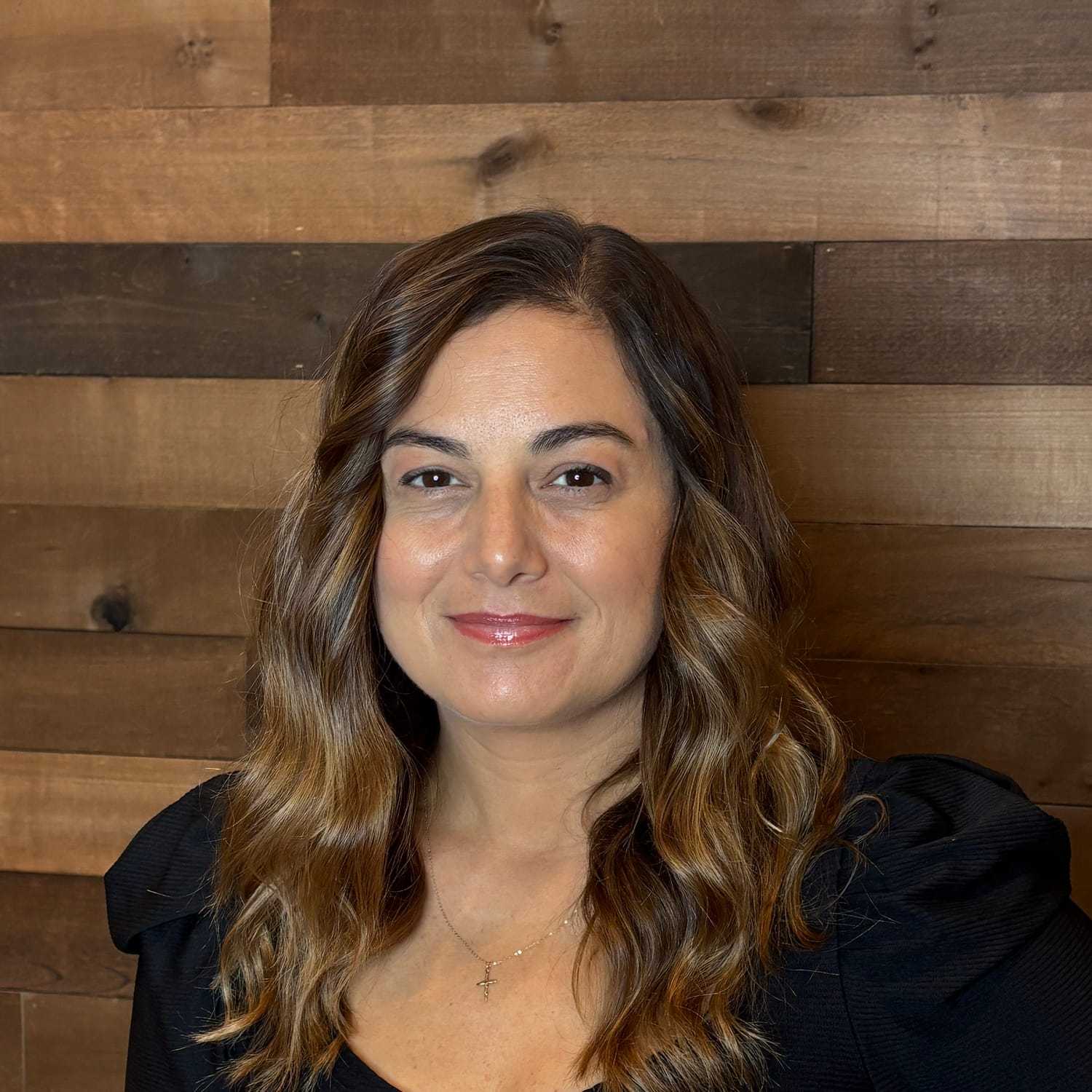 Portrait of Pina, a professional stylist at Laschi Hairstylists & Day Spa, showcasing their expertise and style.