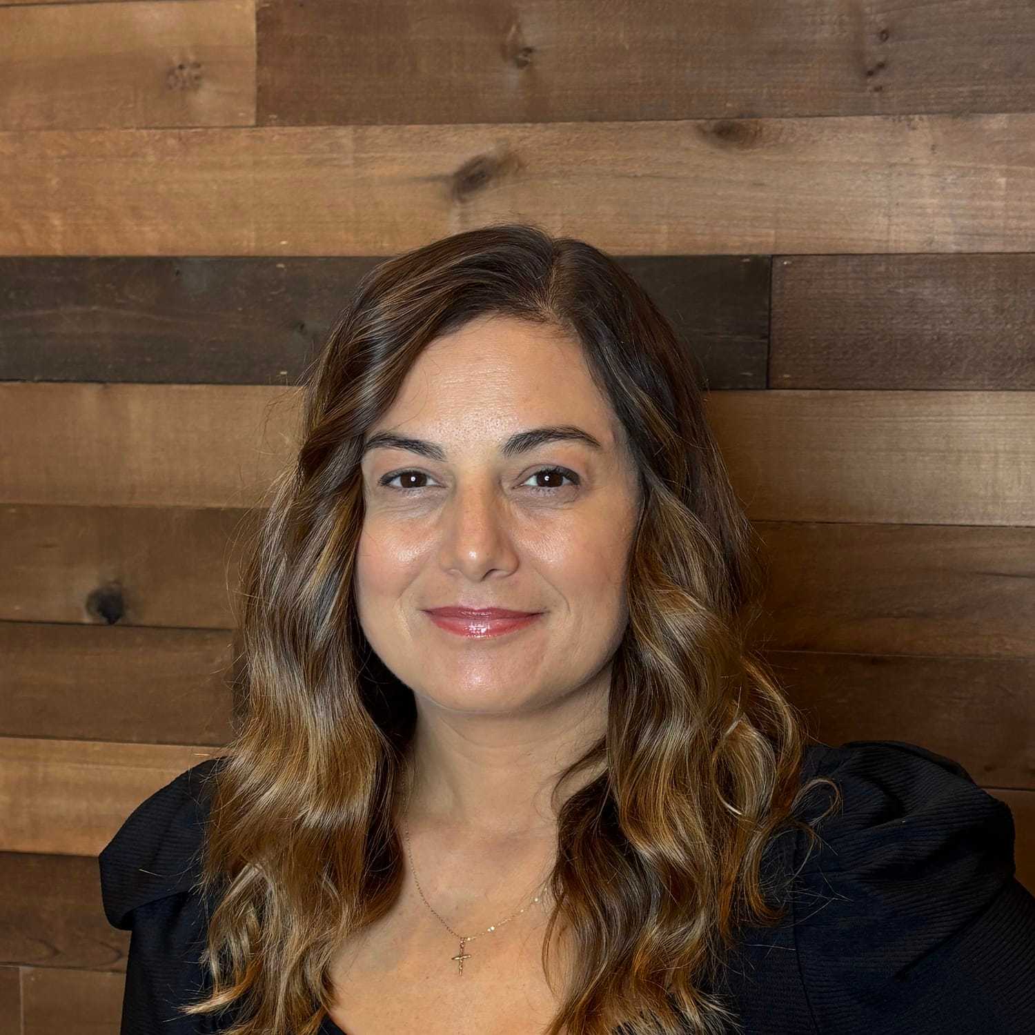 Portrait of Pina, a professional stylist at Laschi Hairstylists & Day Spa, showcasing their expertise and style.