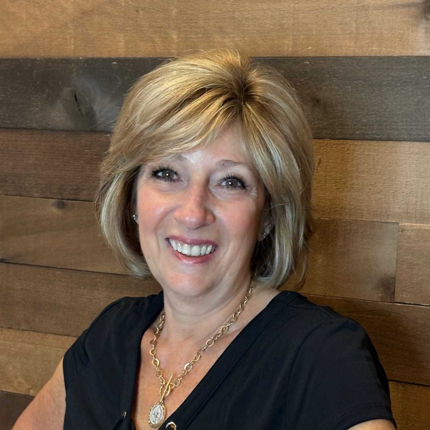 Portrait of Laura, a professional stylist at Laschi Hairstylists & Day Spa, showcasing their expertise and style.