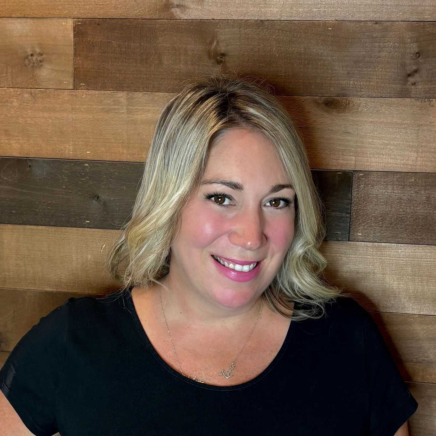Portrait of Meaghan, a professional stylist at Laschi Hairstylists & Day Spa, showcasing their expertise and style.
