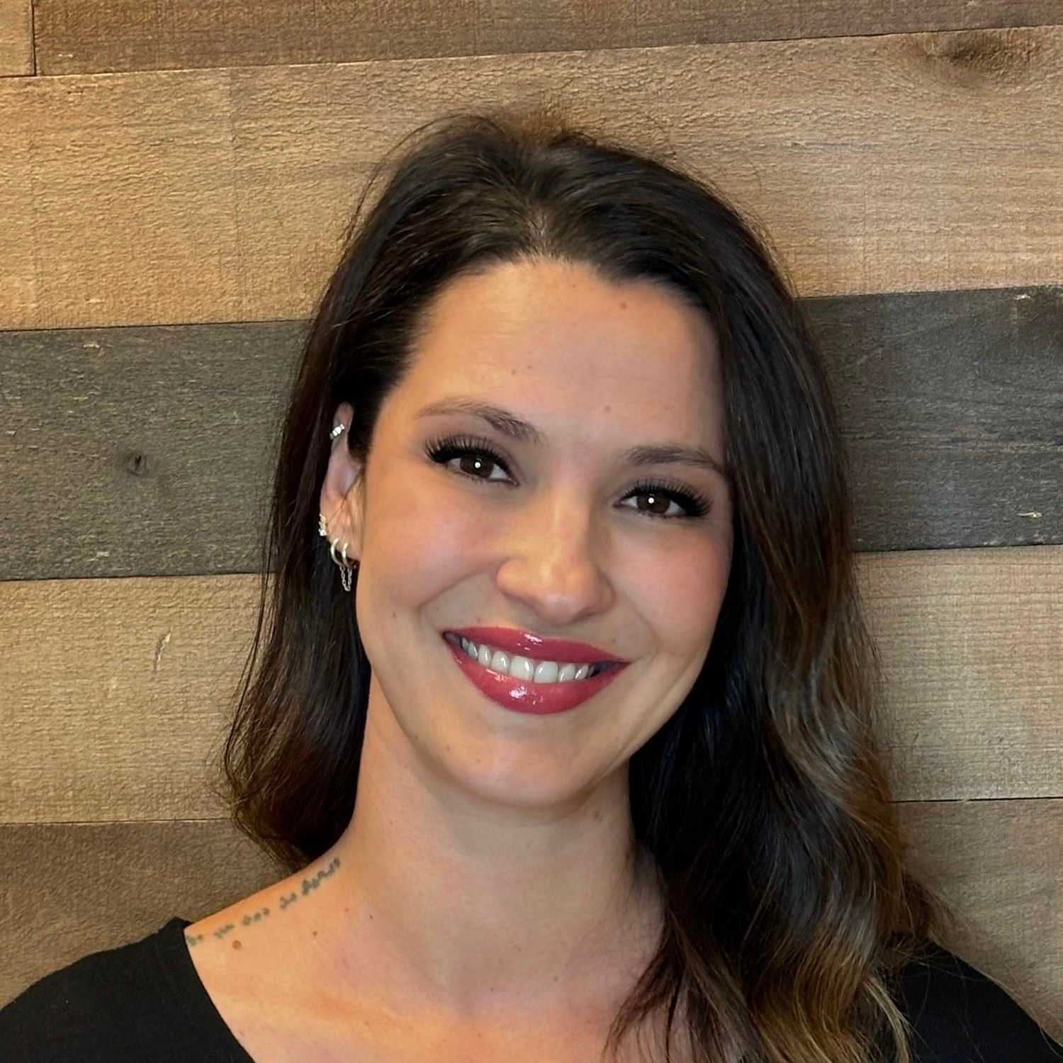 Portrait of Sonia, a professional stylist at Laschi Hairstylists & Day Spa, showcasing their expertise and style.