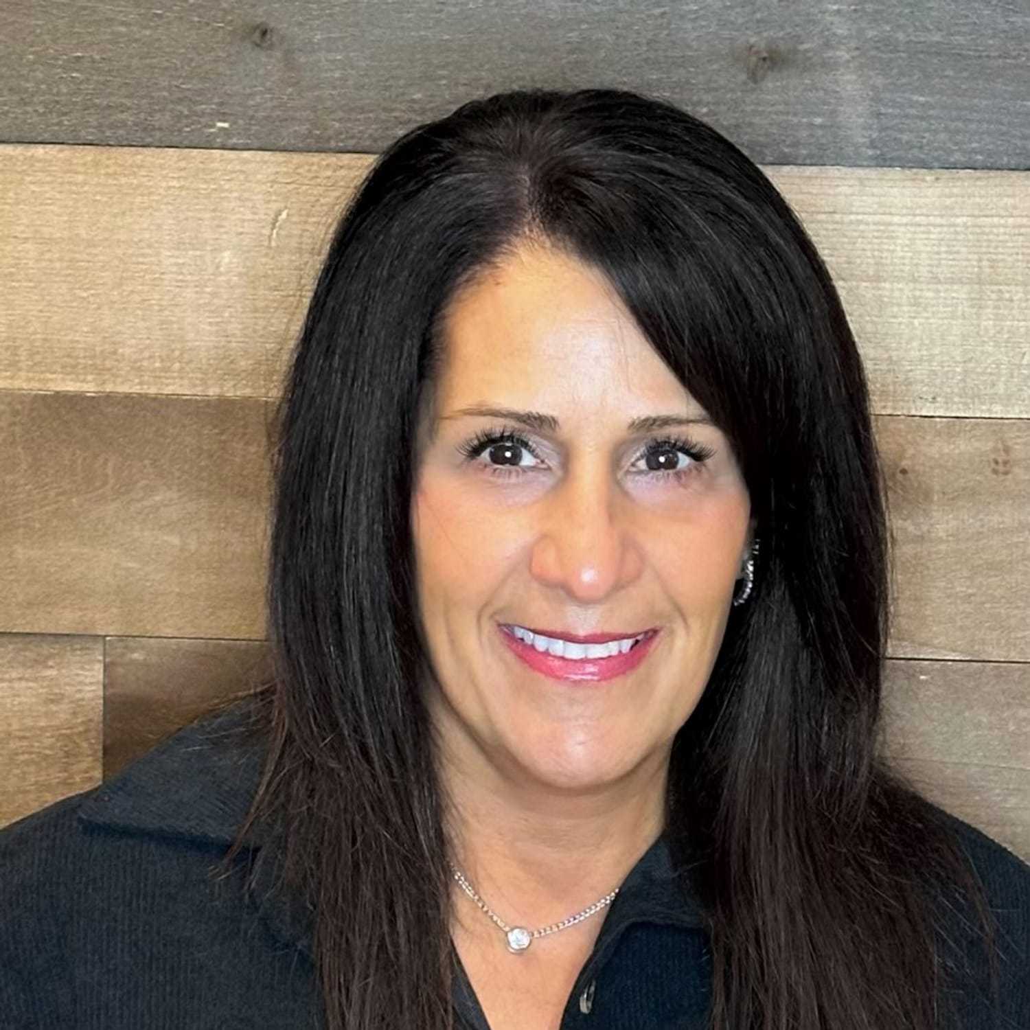 Portrait of Diana, a professional stylist at Laschi Hairstylists & Day Spa, showcasing their expertise and style.