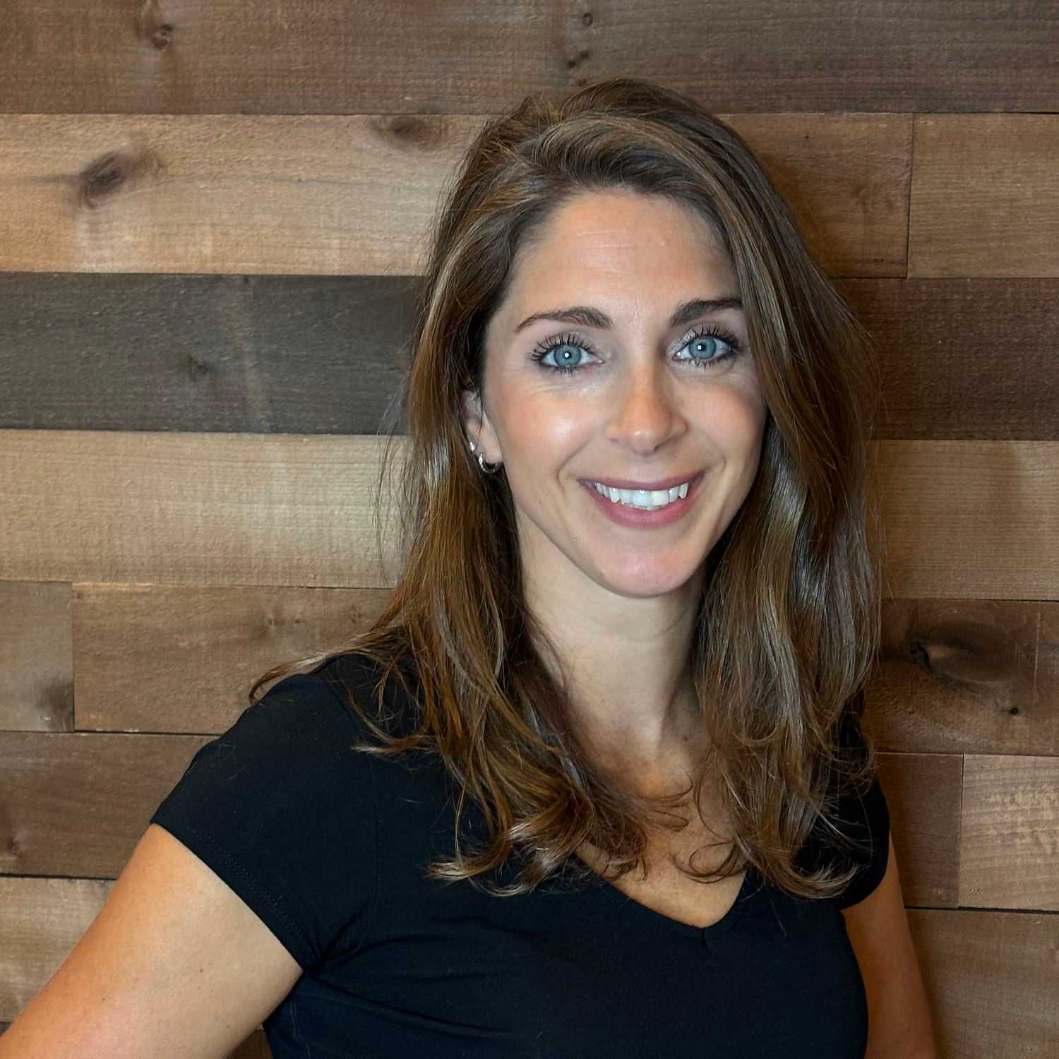Portrait of Julie, a professional stylist at Laschi Hairstylists & Day Spa, showcasing their expertise and style.